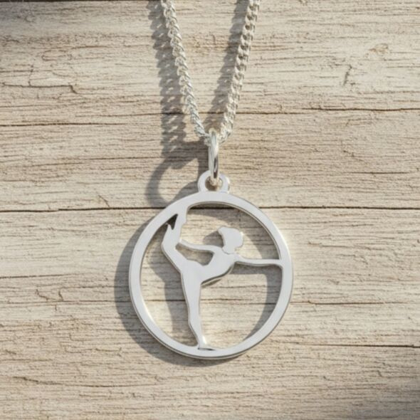 Silver necklace with a silver pendant depicting a cut-out silhouette of a gymnast in a standing split.
Gift idea Christmas Birthday