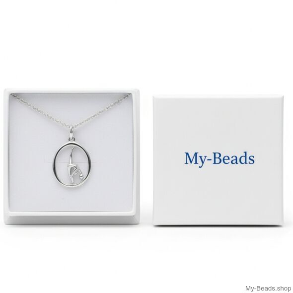 Cadeauverpakkiing. Zilveren hanger met gymnaste die een ritmische gymnastiek oefening met bal op de vloer uitvoert tijdens een wedstrijd.  
Mooi cadeau.