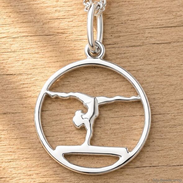 Ciondolo in argento raffigurante una ginnasta che esegue una verticale o un ponte durante una gara di ginnastica. Ciondolo 3D.
Un regalo splendido per un compleanno o natale.