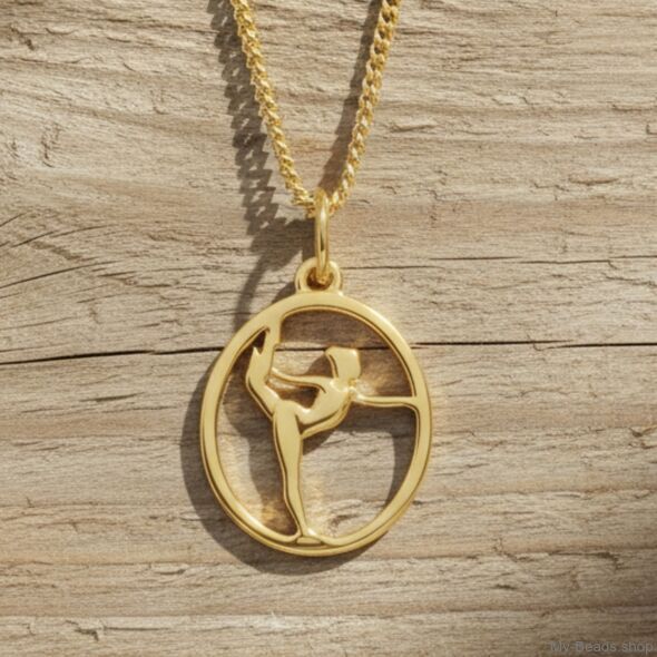 Gold plated zilveren hanger van een gymnaste die een oefening op vloer uitvoert tijdens een wedstrijd.  
Mooi cadeau voor verjaardag of wedstrijd.
